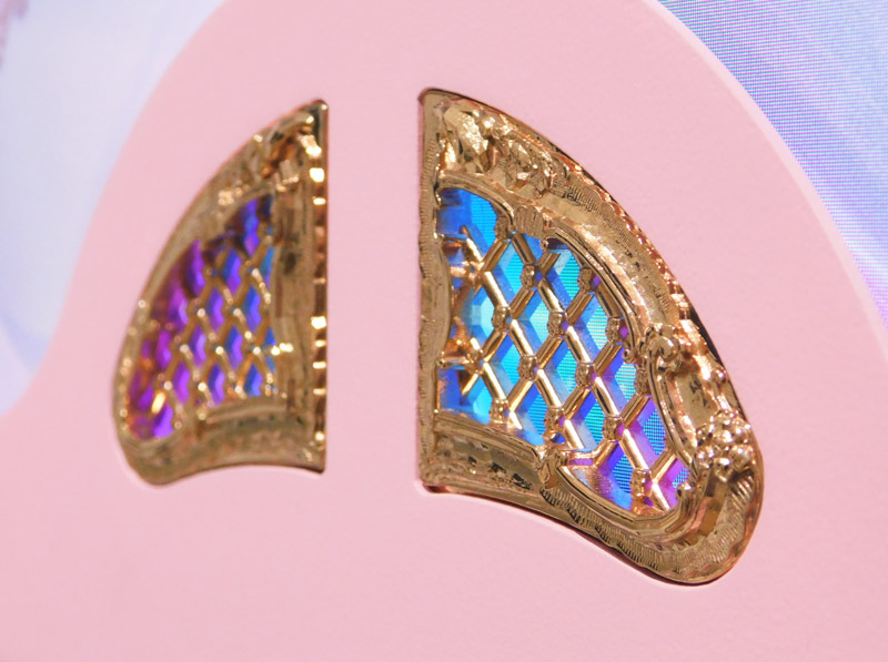 Beam Me Up, 2019, by Jonathan Monaghan, close-up of gold inlays with LED display visible behind them.