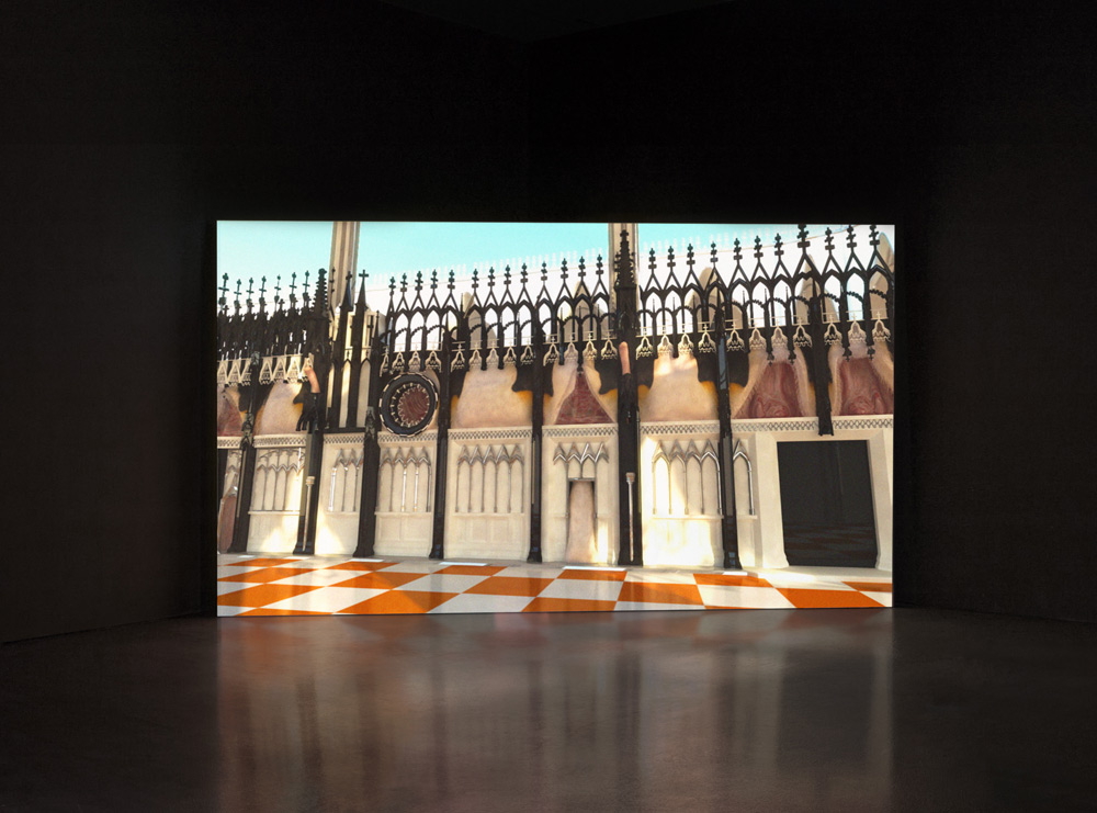 Dark room with video installation in corner