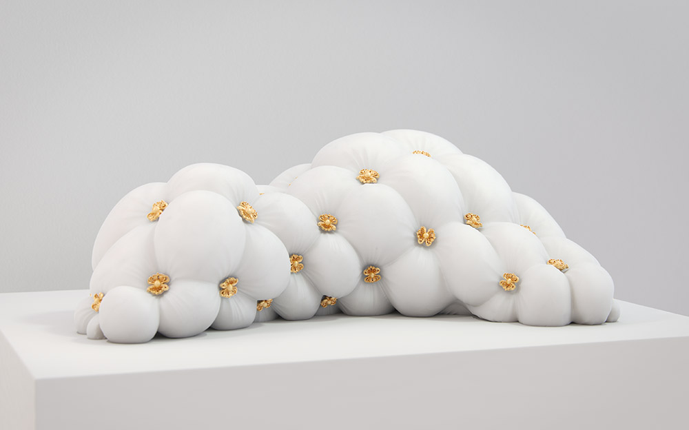 A large marble sculpture resembling a leather-like surface created using digital fabrication