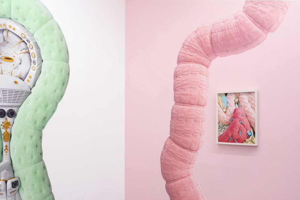 Electronic devices juxtaposed near colorful soft fabrics.