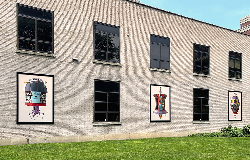 Artwork by featuring ambiguous electronic devices near colorful soft fabrics