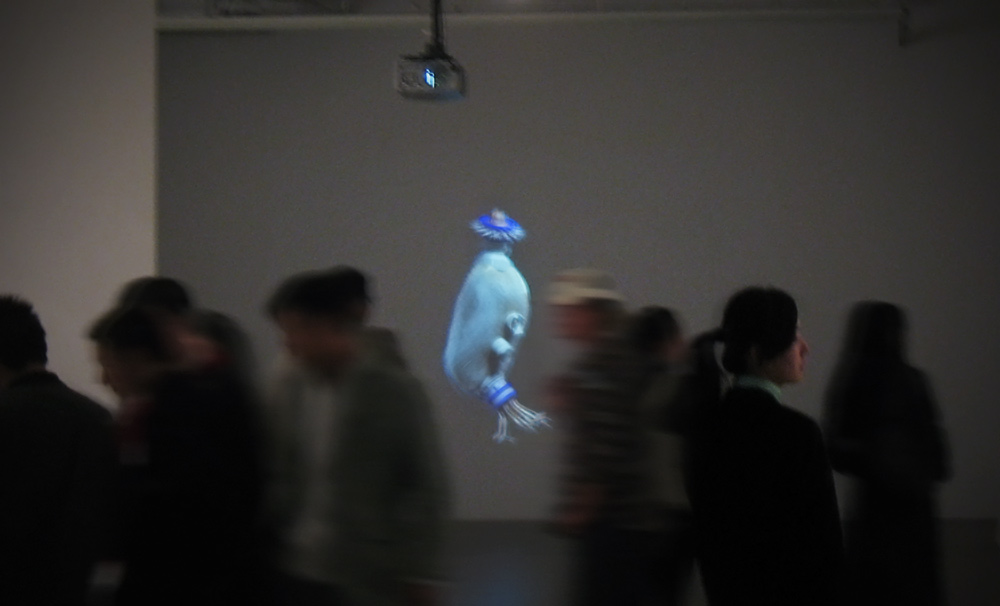 Installation shot of single channel computer animation in a museum in Beijing, china with blurry people walking past it.